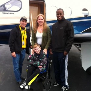 John Hudson beside the PALS airplane.